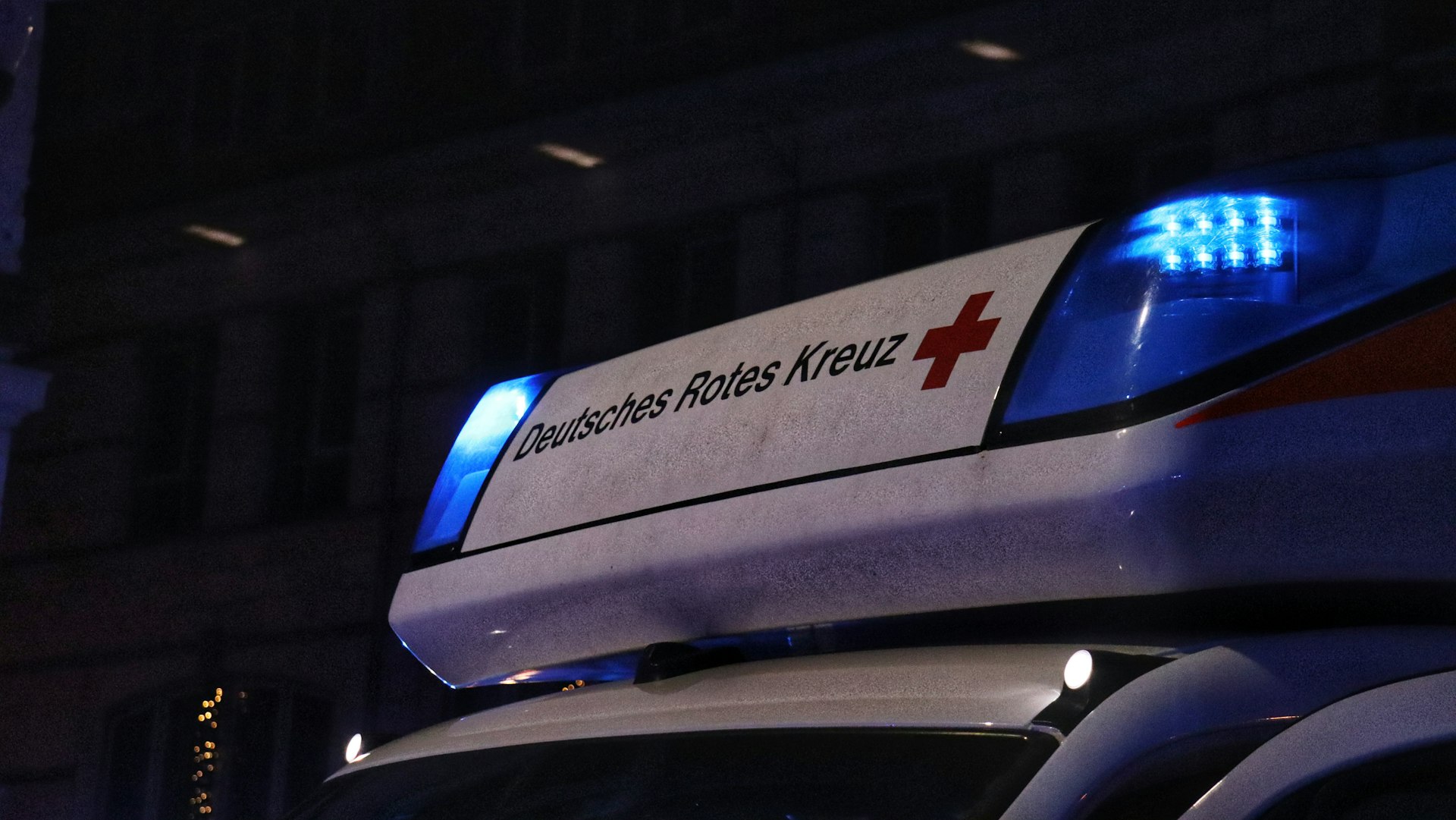 a police car parked in front of a building